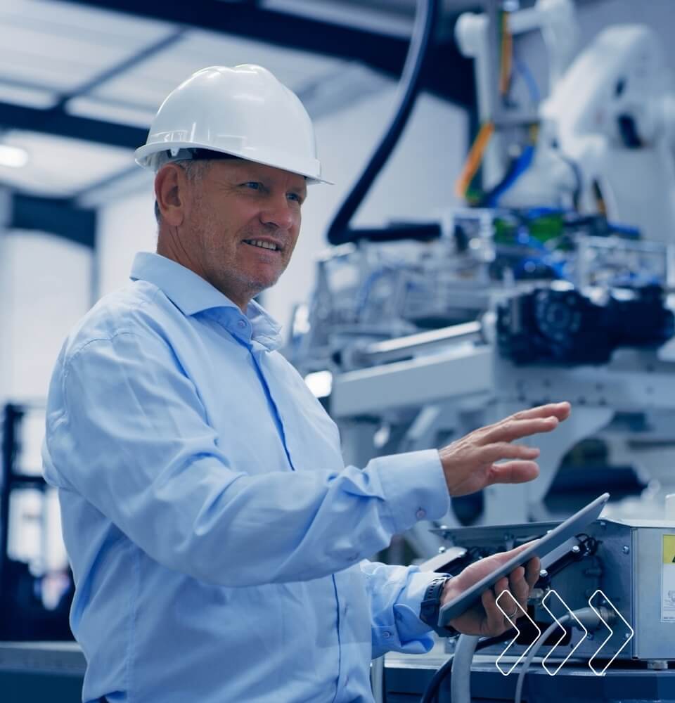 Electronic technician working with robotics equipment, troubleshooting and enhancing automation systems.